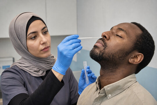 Medical Assistant Performing Nasal Swab Collection