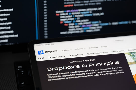 Dropbox Ai company web page on program code background