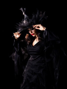 Beautiful witch in black Halloween hat