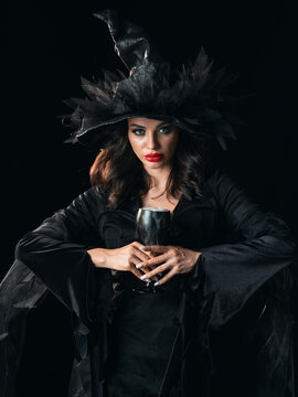 Beautiful witch in black Halloween hat