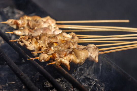 Satay, a famous Indonesian dish, with skewered meat grilled over hot charcoal