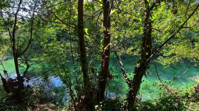 Footage of Nera river flowing through the crystal clear waters of Mole di Narni, Italy