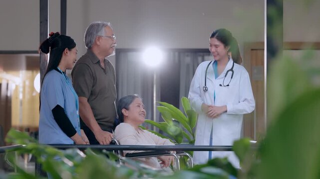 Hospital doctor patient wheelchair family senior man woman healthcare clinic caregiver smiling medical consultation Asian support facility corridor recovery balcony nurse