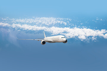 Fototapeta premium White passenger airplane flying in the sky amazing clouds in the background - Travel by air transport