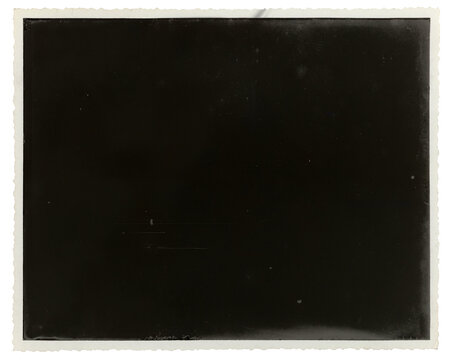 Antique paper photograph with distinctive deckled edges and a heavily damaged, burnt-out, and scratched black central image area. Vintage photo texture cutout, transparent background PNG.