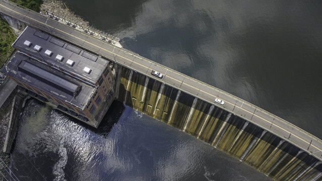 Aerial view of Stevenson Generating Station hydroelectric powerhouse and dam with a road crossing the structure in Monroe, CT, United States.