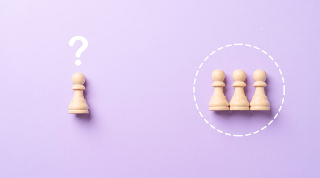 Isolated chess pawn questioning three pawns representing teamwork and decision-making