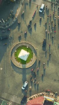 Overhead aerial view of Tugu Yogyakarta roundabout and pedestrians