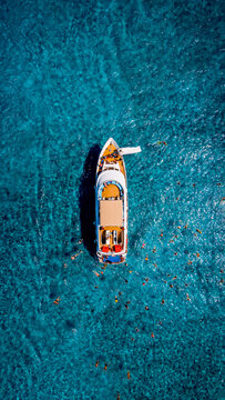 Aerial top down view of a luxury yacht anchored in the Blue Lagoon.