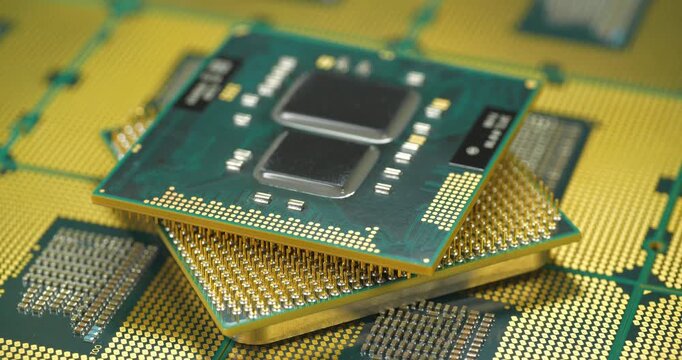 Central processing units with chip sets and golden pins and contacts for a personal computer, essential for computing tasks