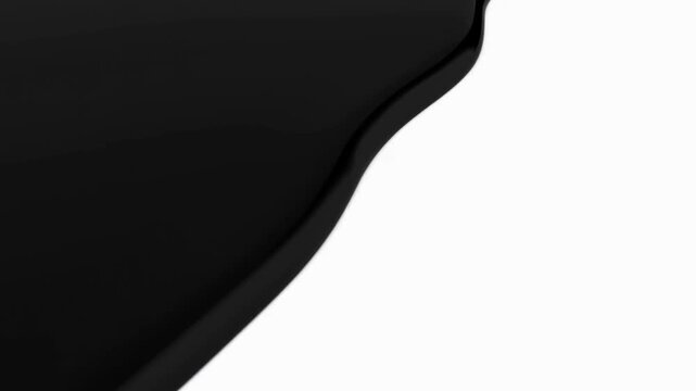 Black liquid pouring and spreading across white background surface