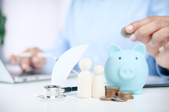 Health Insurance and Family Financial Protection Concept with Stethoscope, Piggy Bank, Coins, Savings and Medical Care Planning for Household Security and Healthcare Costs