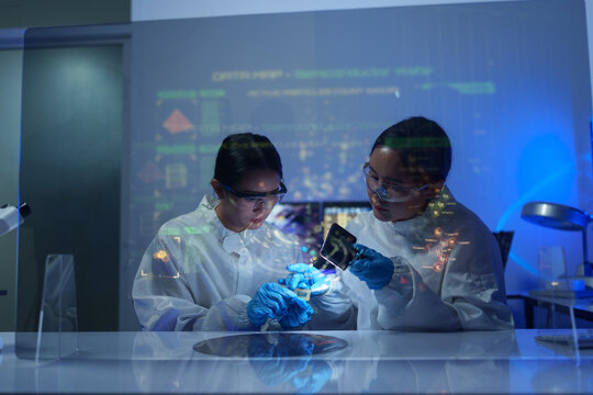 Engineers work in semiconductor or microchip labs in the electronics industry. Electronic engineers in computer technology, CPU maintenance, hardware, motherboard component upgrades.