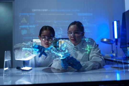 Engineers work in semiconductor or microchip labs in the electronics industry. Electronic engineers in computer technology, 
