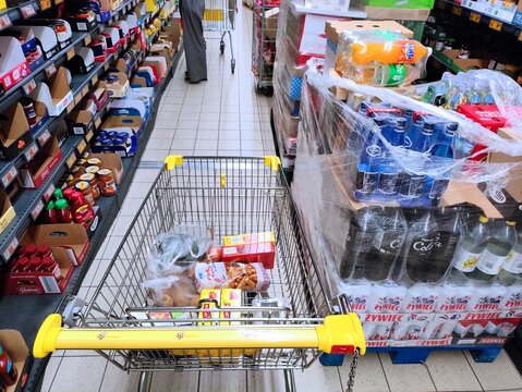 BYTOM, POLAND - AUGUST 12, 2024: Merchandise pallets parked in an aisle in Biedronka supermarket in Bytom, Poland.