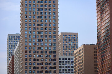 Fototapeta premium New residential buildings. House development, real estate, high-rise construction