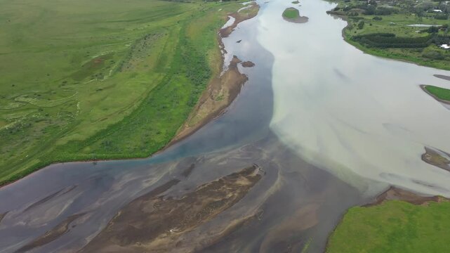Glacial water and clear mountain water meet, Stora Laxa, Iceland