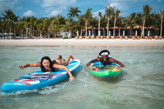 Luxury beach resort vacation with young couple, tourist enjoying water activities on summer vacation