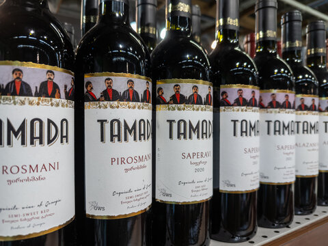 Kyiv, Ukraine - March 14, 2026: Tamada wine bottles displayed on a store shelf, showcasing a diverse selection of authentic Georgian alcohol products ready for retail purchase