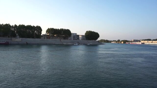 Rh&ocirc;ne River Waterfront and Arles Cityscape at Sunset, Provence, France