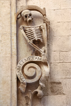 Grim reaper skeleton on Church of Purgatory (1747), Bitonto, Italy. Latin text together with Image 175163408: Qua hora non putaits veninam et metam, means: at an unexpected hour, I'll come and kill.