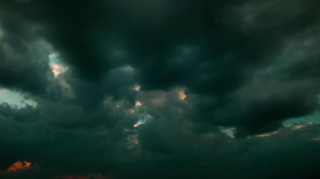 Dark stormy clouds gathering in the sky before rain storm weather gloomy overcast