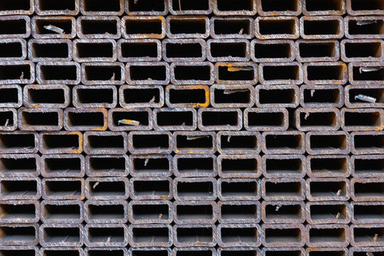 Close-up of Stacked Rusted Rectangular Metal Tubes