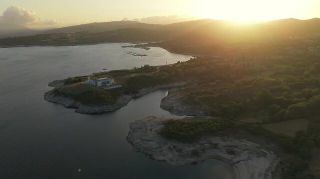 Aerial view of Dam of Pisoes and Albufeira do Alto Rabagao reservoir at sunset in Uniao das Freguesias de Viade de Baixo e Fervidelas, Vila Real, Portugal.