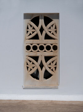 Decorative marble window treatments on a traditional Cycladic house on Mykonos Island, Greece