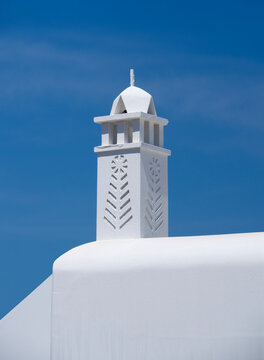 Chimney pipe on a house in the traditional Cycladic style on the island of Mykonos, Greece.