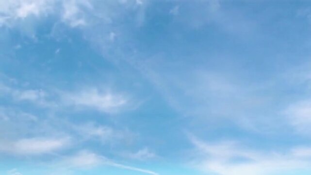Delicate Wispy Cirrus Clouds Swirling in Azure Blue Sky Loop