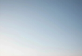 Fototapeta premium Clear blue sky with a subtle gradient from light to dark, tranquility and open space, Clear blue sky with a gentle gradient from a lighter tone at the bottom to a deeper blue at the top