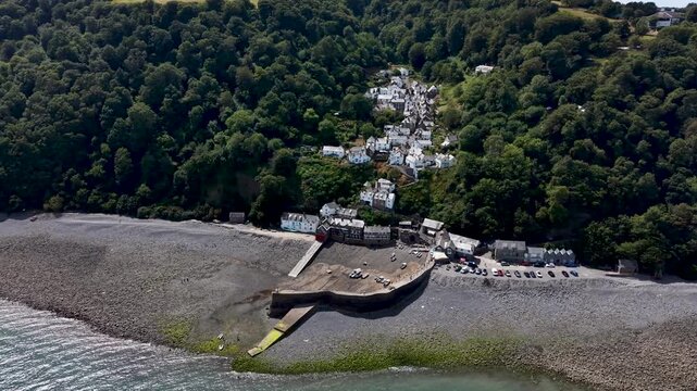 Aerial view of clovelly village harbour and pebble beach in north devon england