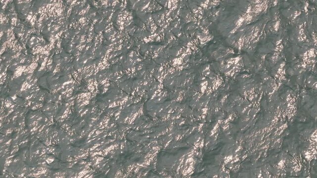 Drone aerial looking down at windy weather on Great Lakes Lake Erie outside Cleveland, Ohio as natural sunny weather with sun and wind hitting waves on water surface in sea and Ocean landscape ocean
