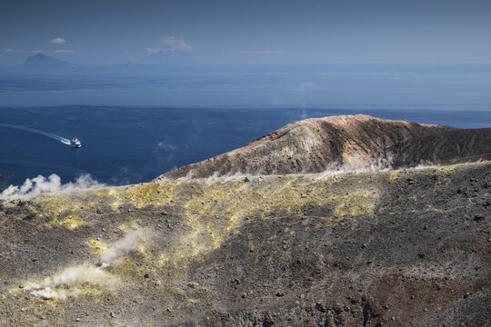 Ferry, crater rim, sulfur vapors rise, in the background Panarea and Stromboli volcano, Vulcano, Aeolian or Aeolian Islands, Sicily, southern Italy, Italy