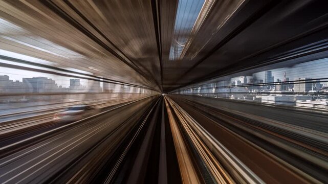Motion timelapse of futuristic automated train in Tokyo, Japan. Asia tourism, public transport, technology and innovation concept, daytime. 
