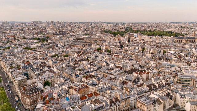 Dense historic rooftops forming an urban pattern across Paris