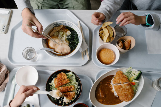 Family eating Japanese food together.