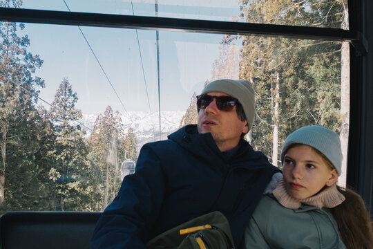Father and daughter riding gondola