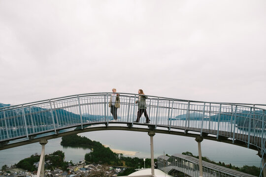 Two children on elevated bridge
