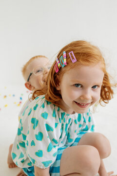 Kids play together in a bright space