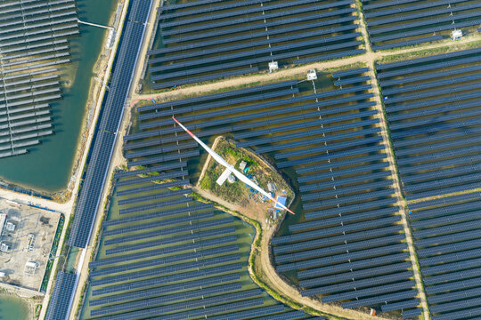  vast floating solar farm and wind turbines over water