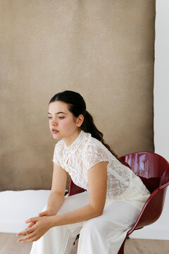 Young woman sitting pensive 