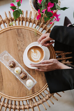 Woman holding a cup of coffee