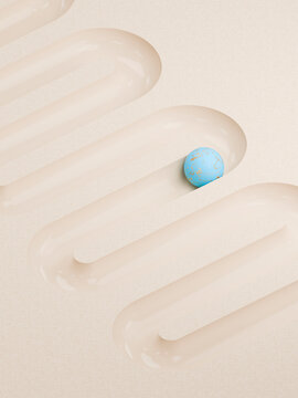 Colorful Ball Sits in Groove Near Other Grooves on Surface