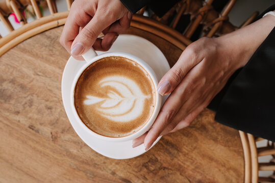 Woman holding a cup of coffee