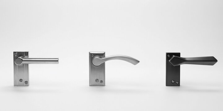 Three distinct door handles with different arranged on a white background