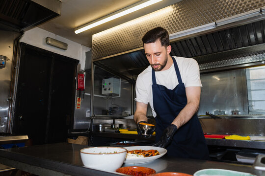 Chef assembling the mixed grill plate