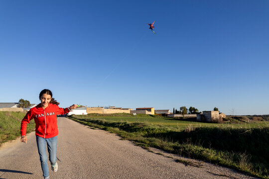 flying kite over blue sky
