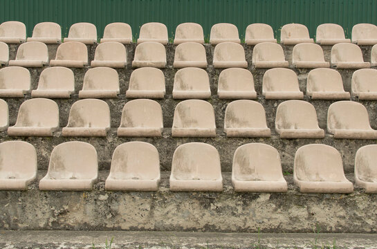 Old plastic chairs on stadium